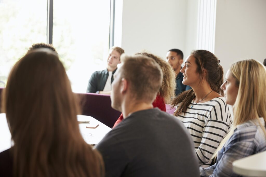 Group Of University Students Attending Lecture On Campus